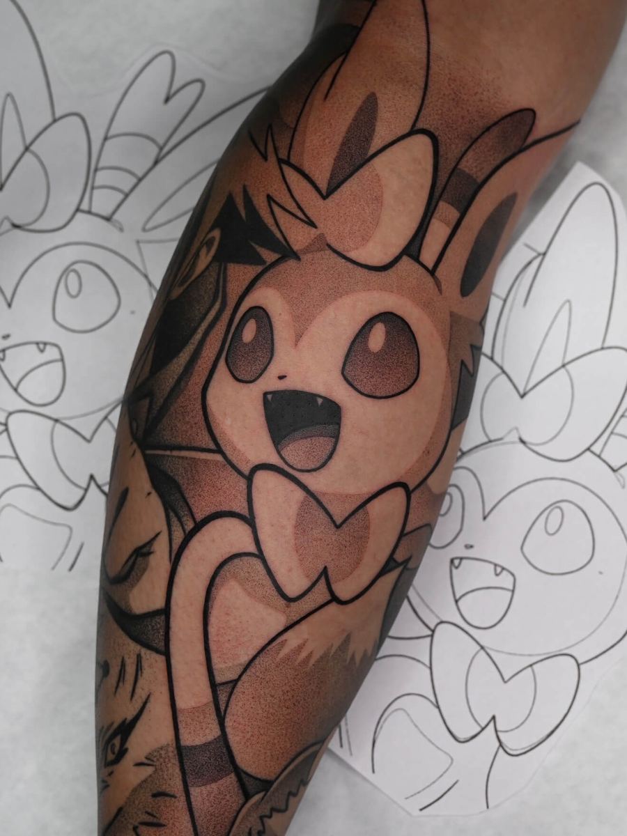Sylveon tattoo, Pokemon character with heart-shaped ribbon tail details by Wade Whitman — Madison Heights MI tattoo artist