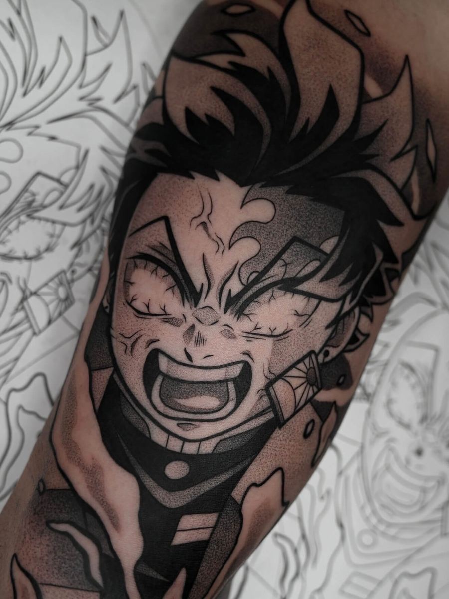 Tanjiro Kamado tattoo, Demon Slayer character forearm portrait with intense expression by Wade Whitman — Madison Heights MI tattoo artist