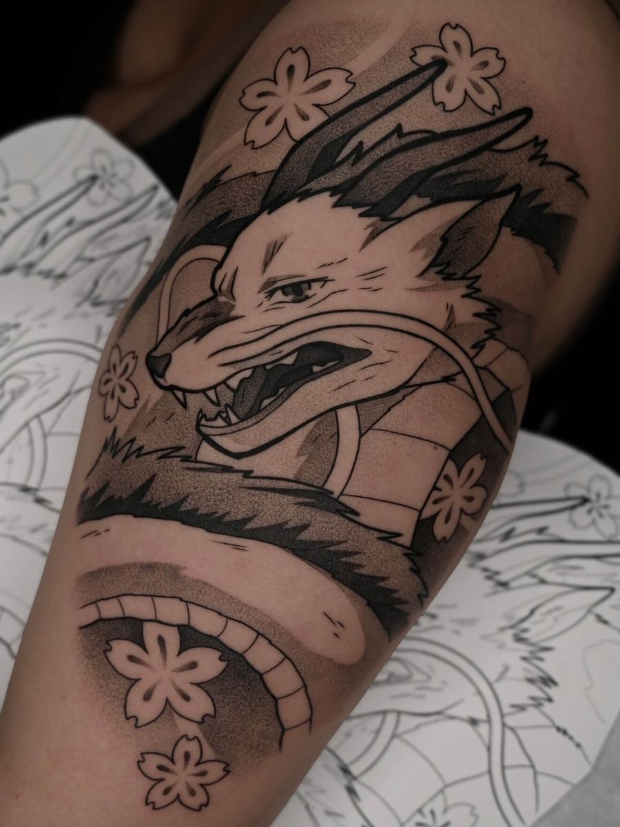 Haku tattoo, Spirited Away character with fox companion and cherry blossom details by Wade Whitman — Madison Heights MI tattoo artist
