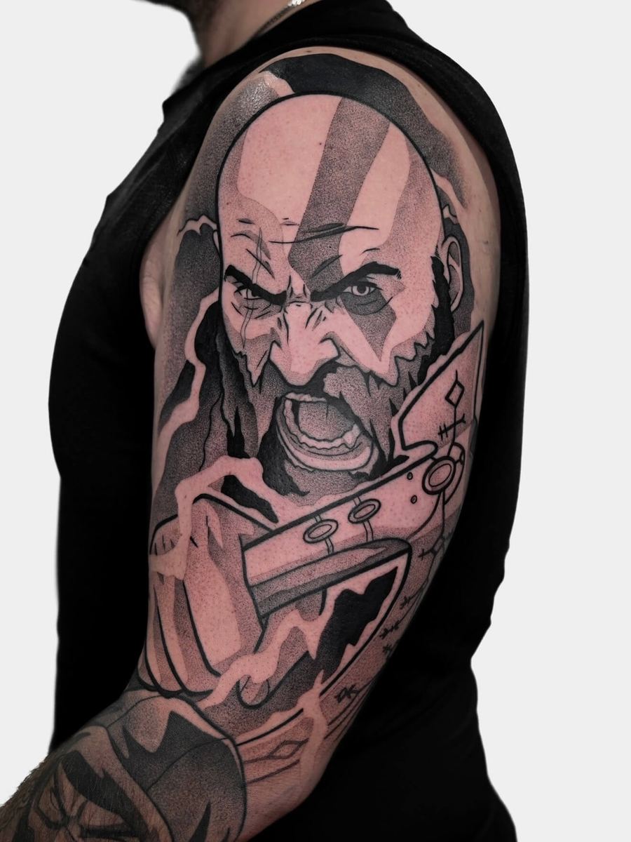 Kratos tattoo, God of War Ragnarok character full arm portrait with stern expression by Wade Whitman — Madison Heights MI tattoo artist