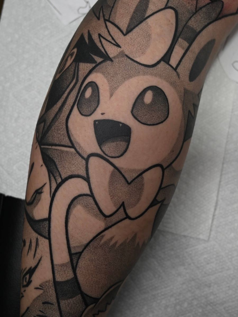 Sylveon tattoo, Pokemon character with heart-shaped ribbon tail detail by Wade Whitman — Madison Heights MI tattoo artist