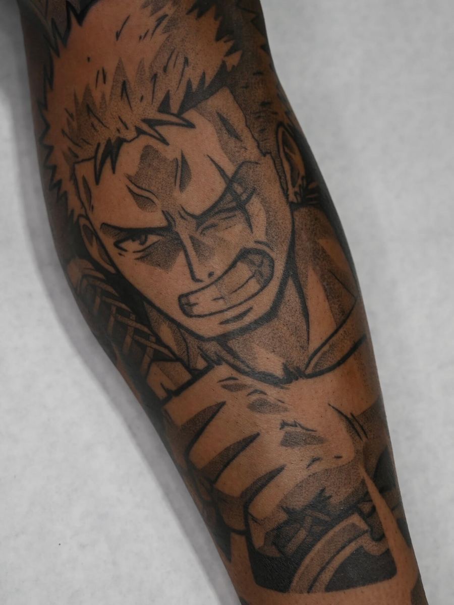 Roronoa Zoro tattoo, One Piece character holding a sword, intense forward-facing scowl by Wade Whitman — Madison Heights MI tattoo artist