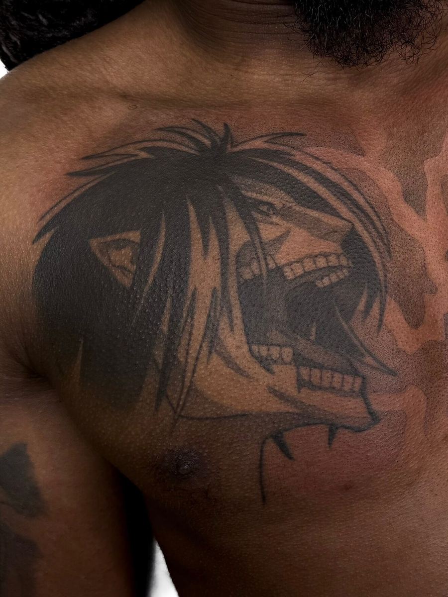 Attack Titan tattoo, Attack on Titan character chest piece with skull motif and messy hair by Wade Whitman — Madison Heights MI tattoo artist
