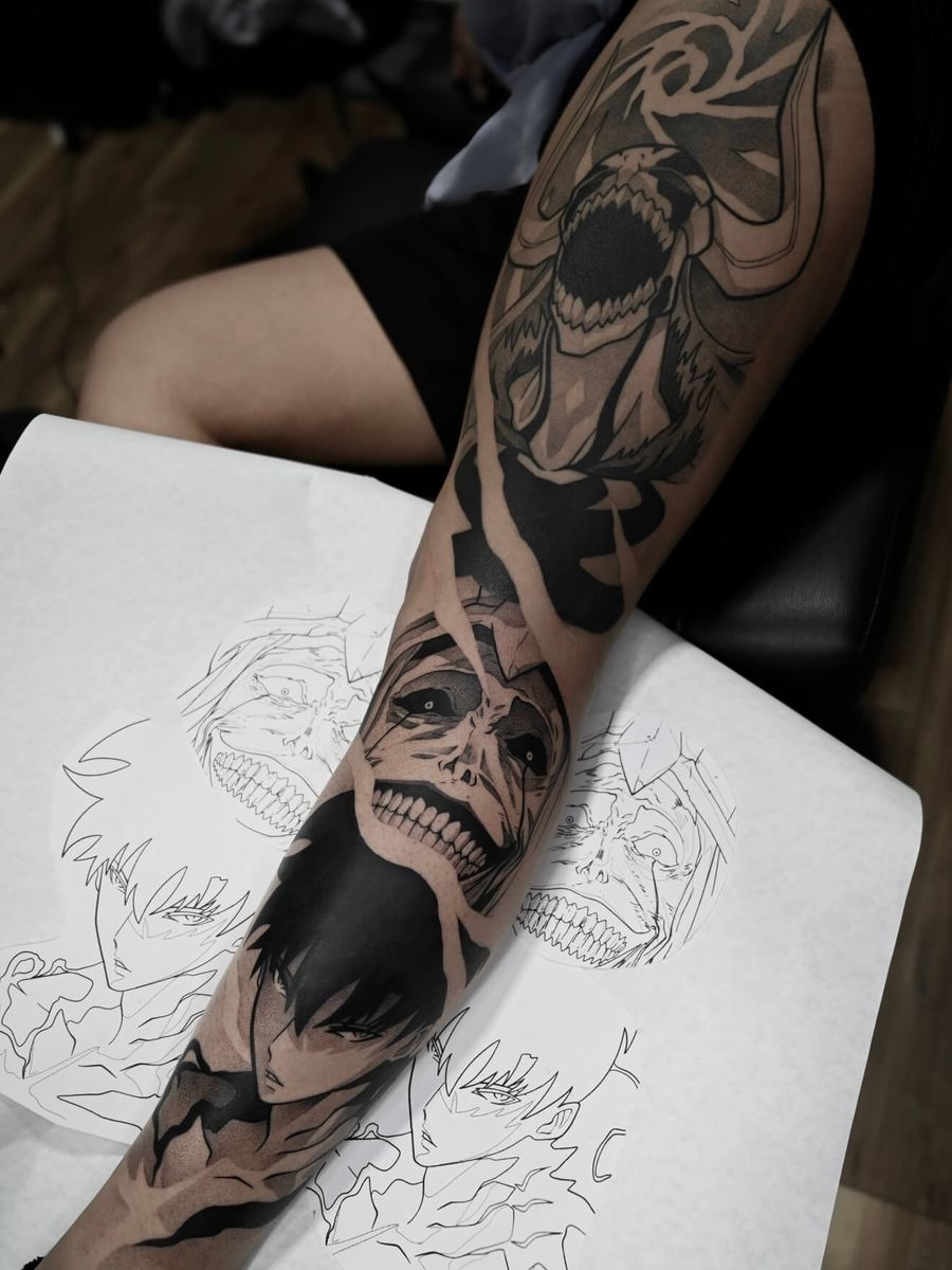 Hollow Ichigo, Sung Jin-Woo, and the God Statue tattoo, Bleach and Solo Leveling full arm sleeve paired with original line art reference by Wade Whitman — Madison Heights MI tattoo artist